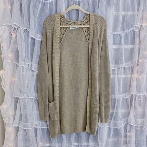 Lizard Thicket: Long, tan cardigan